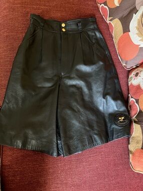 Couregges Black Leather High-Waist Shorts with Gold Button Detail